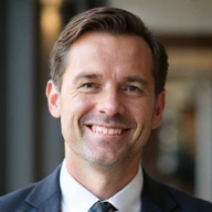 Placeholder image for CEO John Doe, a smiling professional.